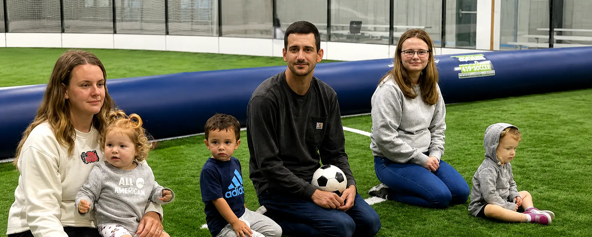 Coach working with young soccer players