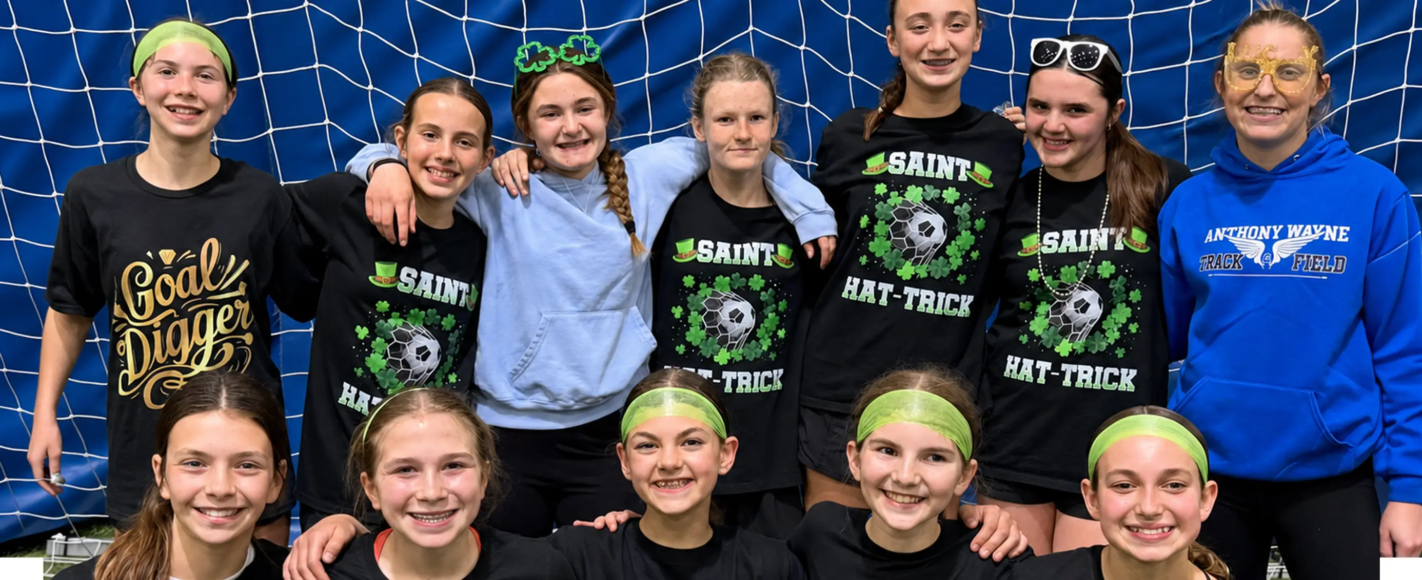 Youth soccer players celebrating a tournament win