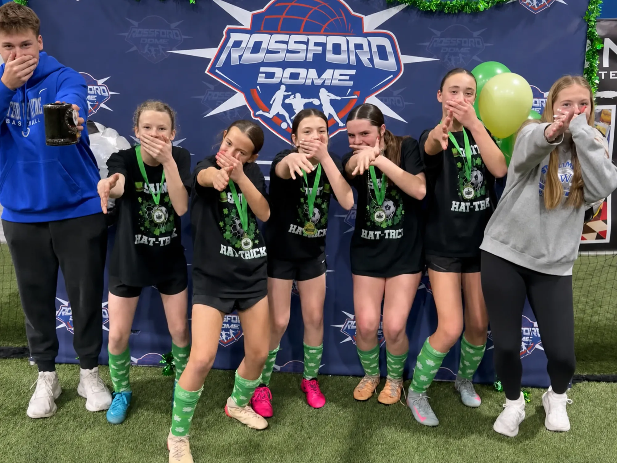 Tournament champions celebrating at Rossford Dome